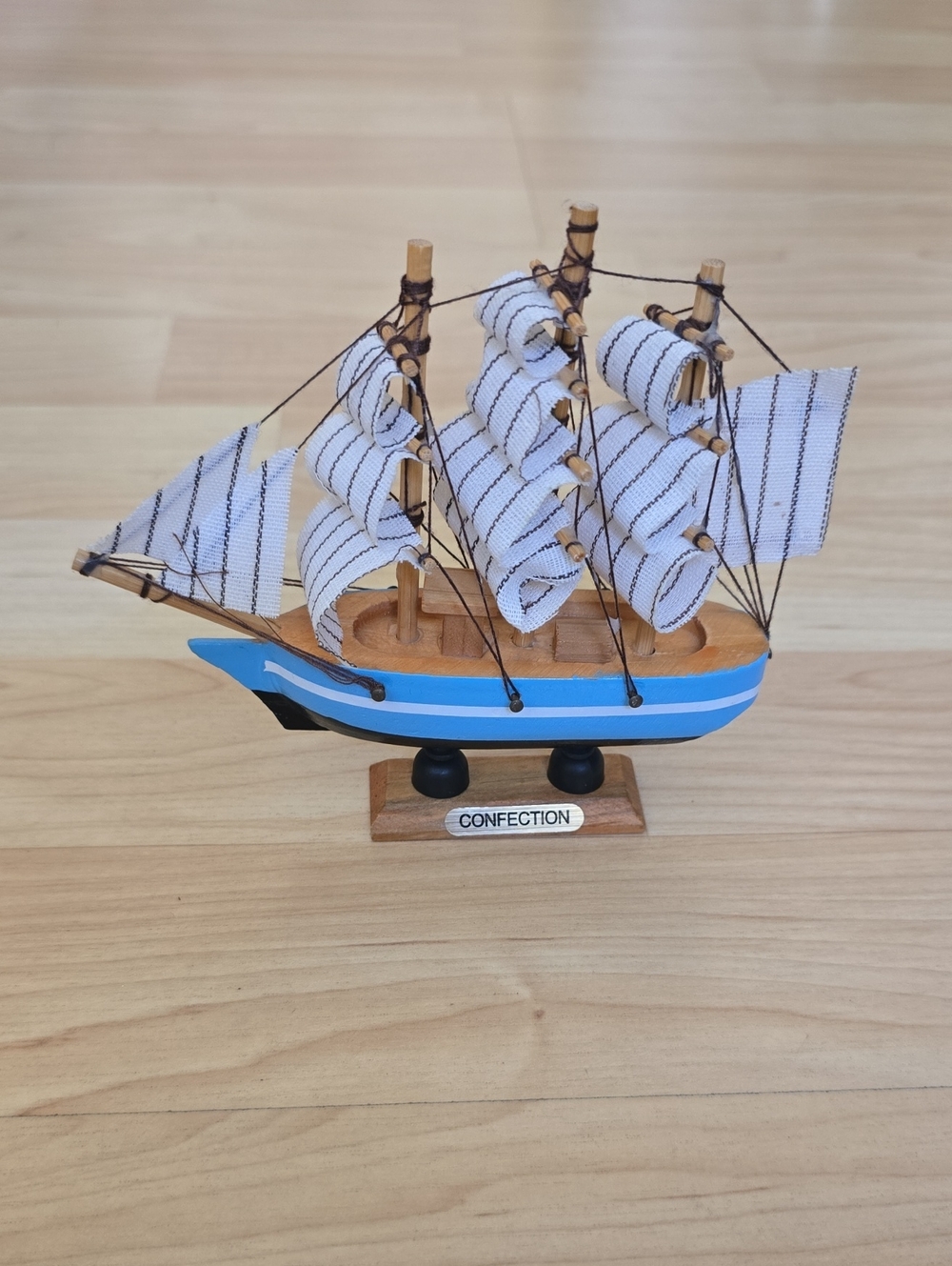 Wooden Nautical Model Ship with Blue Hull and Striped Sails